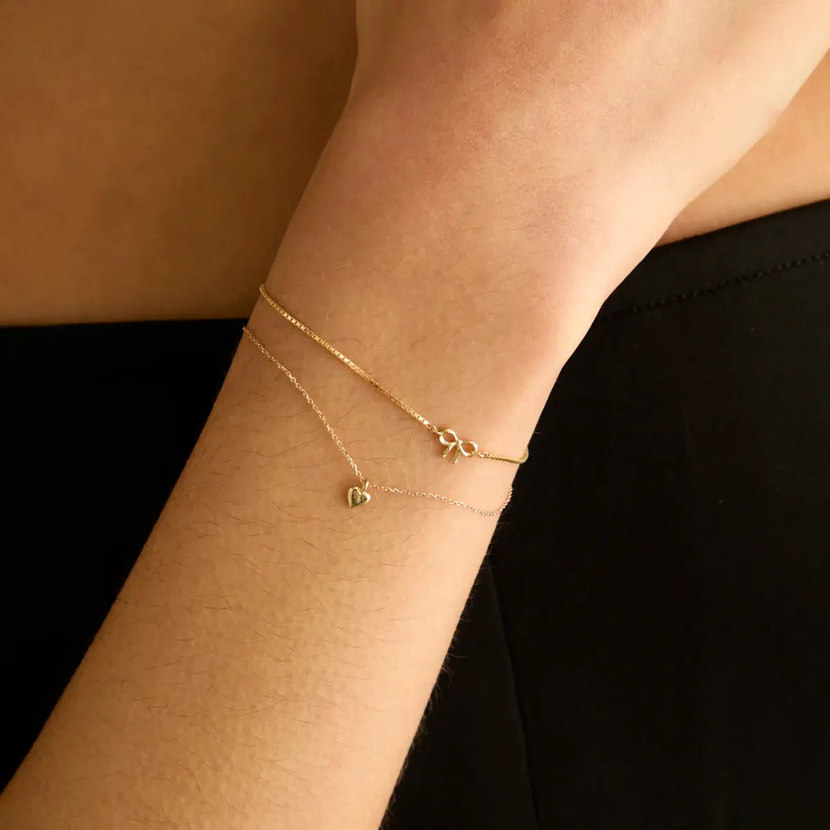 14k guldarmband med rosettberlock