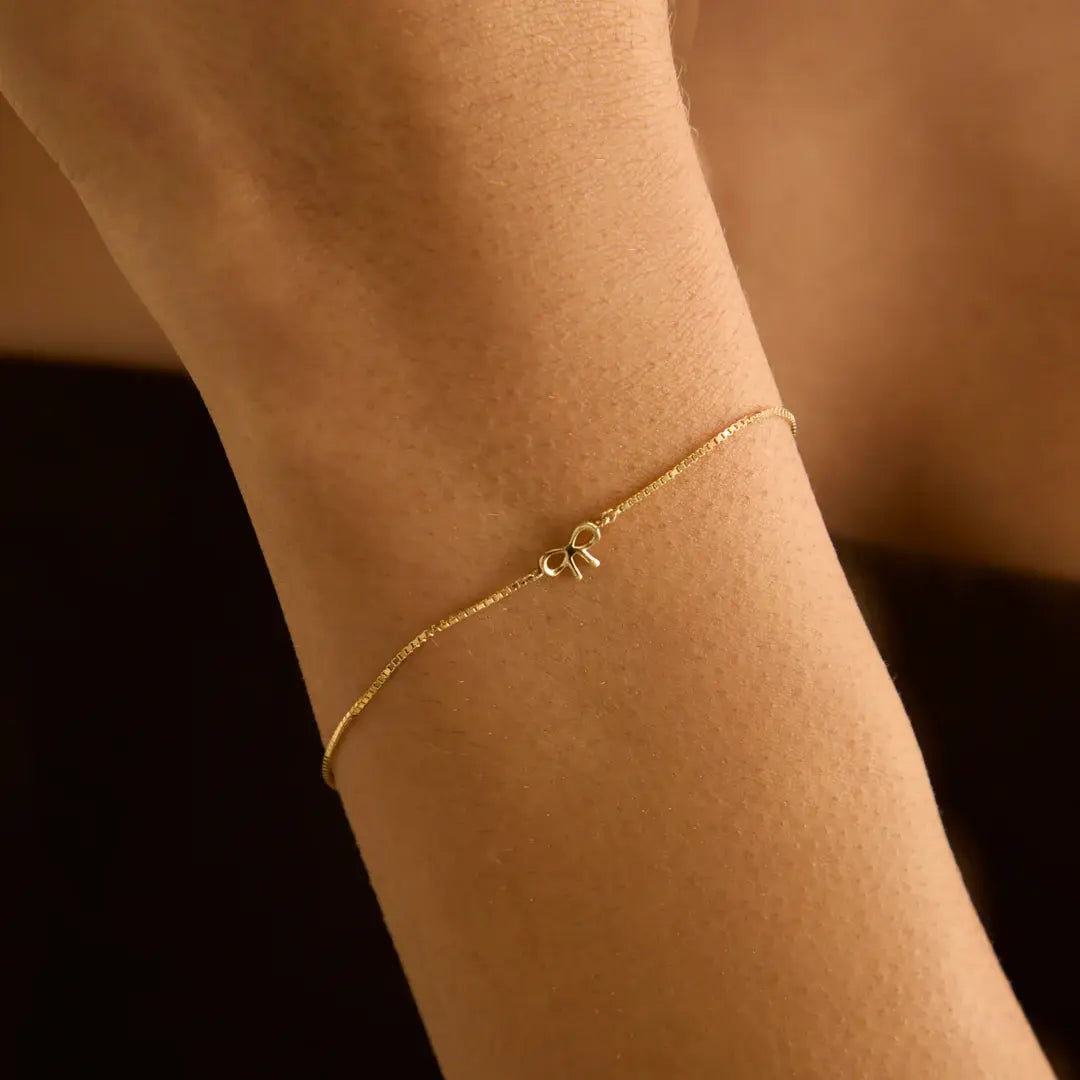 14k guldarmband med rosettberlock